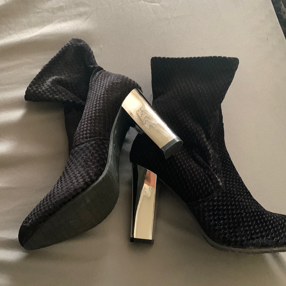 Black booties with sliver heels